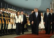 Trump arrive à Pékin en vue d'un sommet des grandes puissances avec Xi
